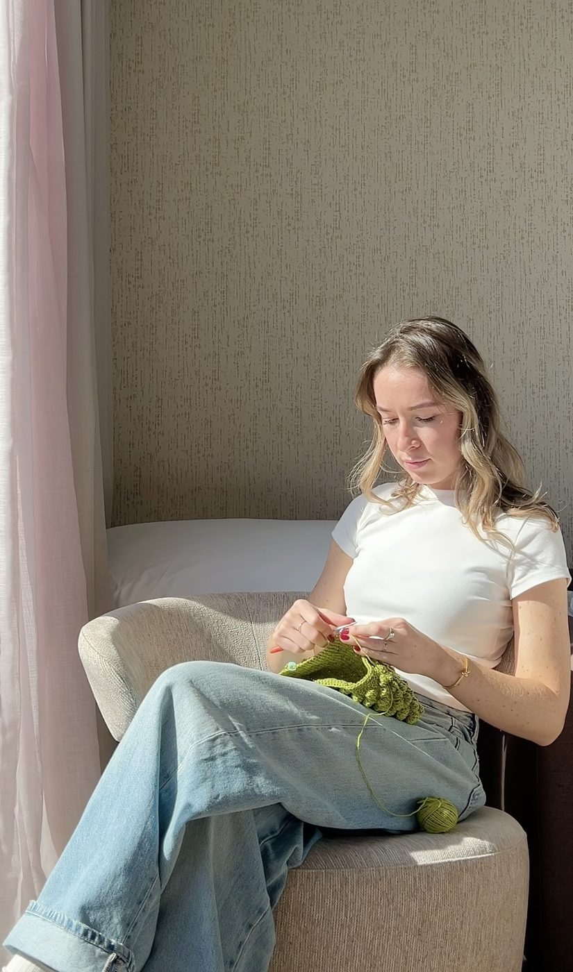 Daria crocheting a bag
